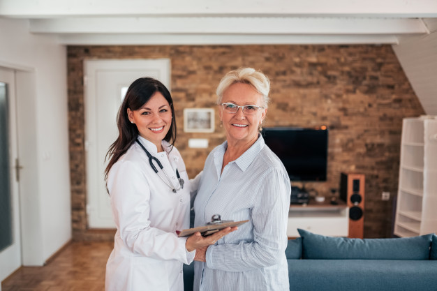 portrait-senior-woman-with-female-doctor-home-visit_109710-1300